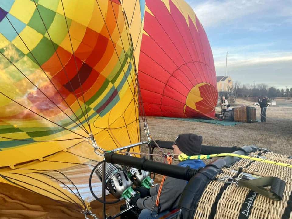 Hot air balloon pilot fires the engine up